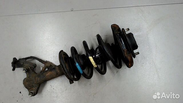 Амортизатор подвески левый передний Nissan Primera